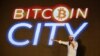 FILE - El Salvador's president Nayib Bukele speaks at the closing party of “Bitcoin Week” where he announced the plan to build the first "Bitcoin City" in the world, in Teotepeque, El Salvador, Nov. 20, 2021. 
