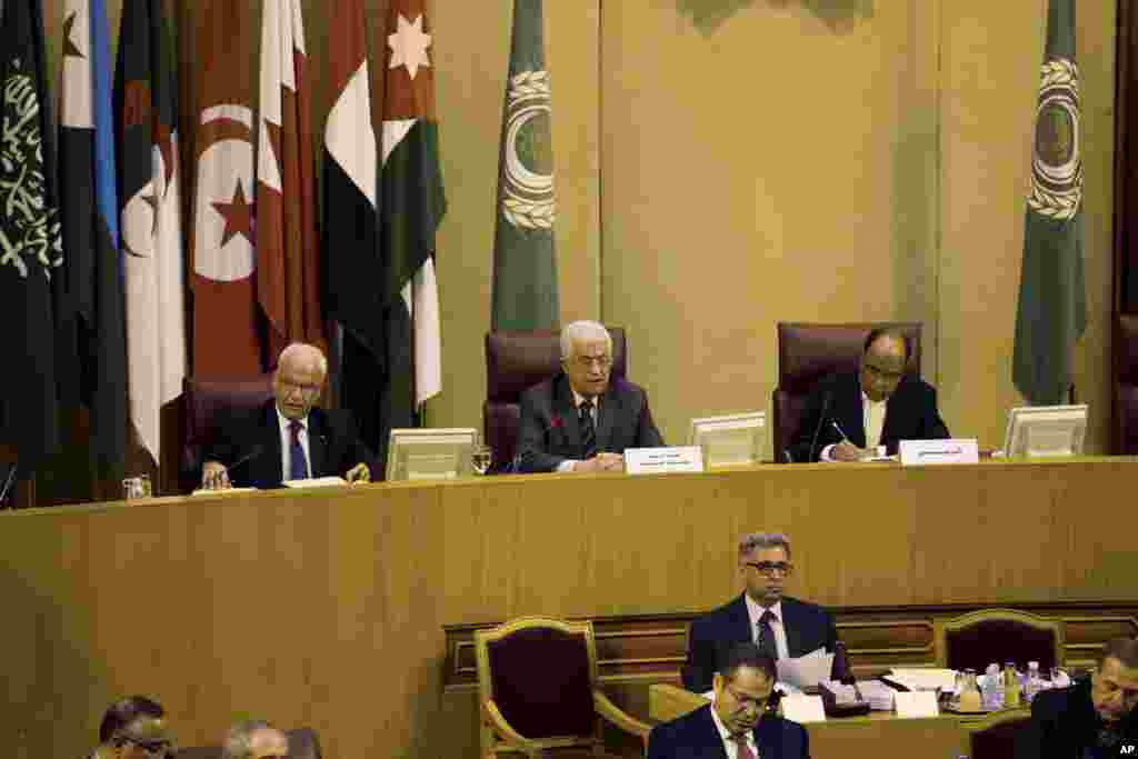 Palestinian President Mahmoud Abbas, center, speaks during an Arab foreign minister meeting at the Arab League headquarters in Cairo, Egypt, Sept. 7, 2014.