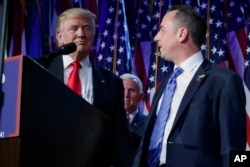 FILE - President-elect Donald Trump (L) stands with Reince Priebus during an election night rally in New York, Nov. 9, 2016.