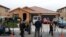 Members of the news media stand outside the home of David Allen Turpin and Louise Ann Turpin in Perris, California, Jan. 15, 2018.