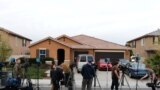 Members of the news media stand outside the home of David Allen Turpin and Louise Ann Turpin in Perris, California, Jan. 15, 2018.