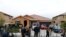 Members of the news media stand outside the home of David Allen Turpin and Louise Ann Turpin in Perris, California, Jan. 15, 2018.