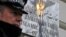 FILE - A police officer stands on duty outside the Iranian embassy in Kensington, central London December 2, 2011.
