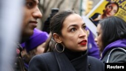 FILE - Rep. Alexandria Ocasio-Cortez (D-NY) speaks during a march organized by the Women's March Alliance in the Manhattan borough of New York City, Jan. 19, 2019. 