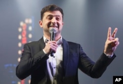 FILE - Volodymyr Zelenskiy, Ukrainian actor and candidate in the upcoming presidential election, hosts a comedy show at a concert hall in Brovary, Ukraine, March 29, 2019.