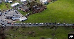 Cars are lined up to buy gas in the aftermath of Hurricane Maria in Toa Alta, Puerto Rico, Sept. 28, 2017.