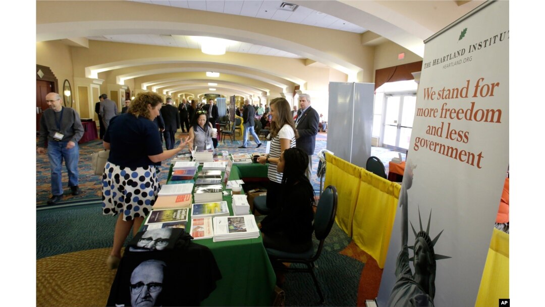 Delegates stop by one of the many information booths at the National Libertarian Party Convention in Orlando, Fla., May 27, 2016.
