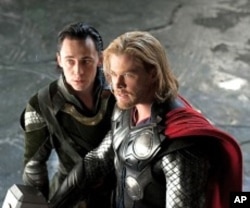 Left to right: Loki (Tom Hiddleston) and Thor (Chris Hemsworth) in THOR, from Paramount Pictures and Marvel Entertainment.