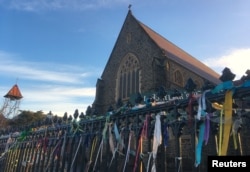Colorful ribbons can be seen tied to the fence outside St. Patrick's Cathedral, a spontaneous gesture to remember victims of Roman Catholic church abuse, in the town of Ballarat, located west of the southern city of Melbourne in Australia, July 23, 2017.
