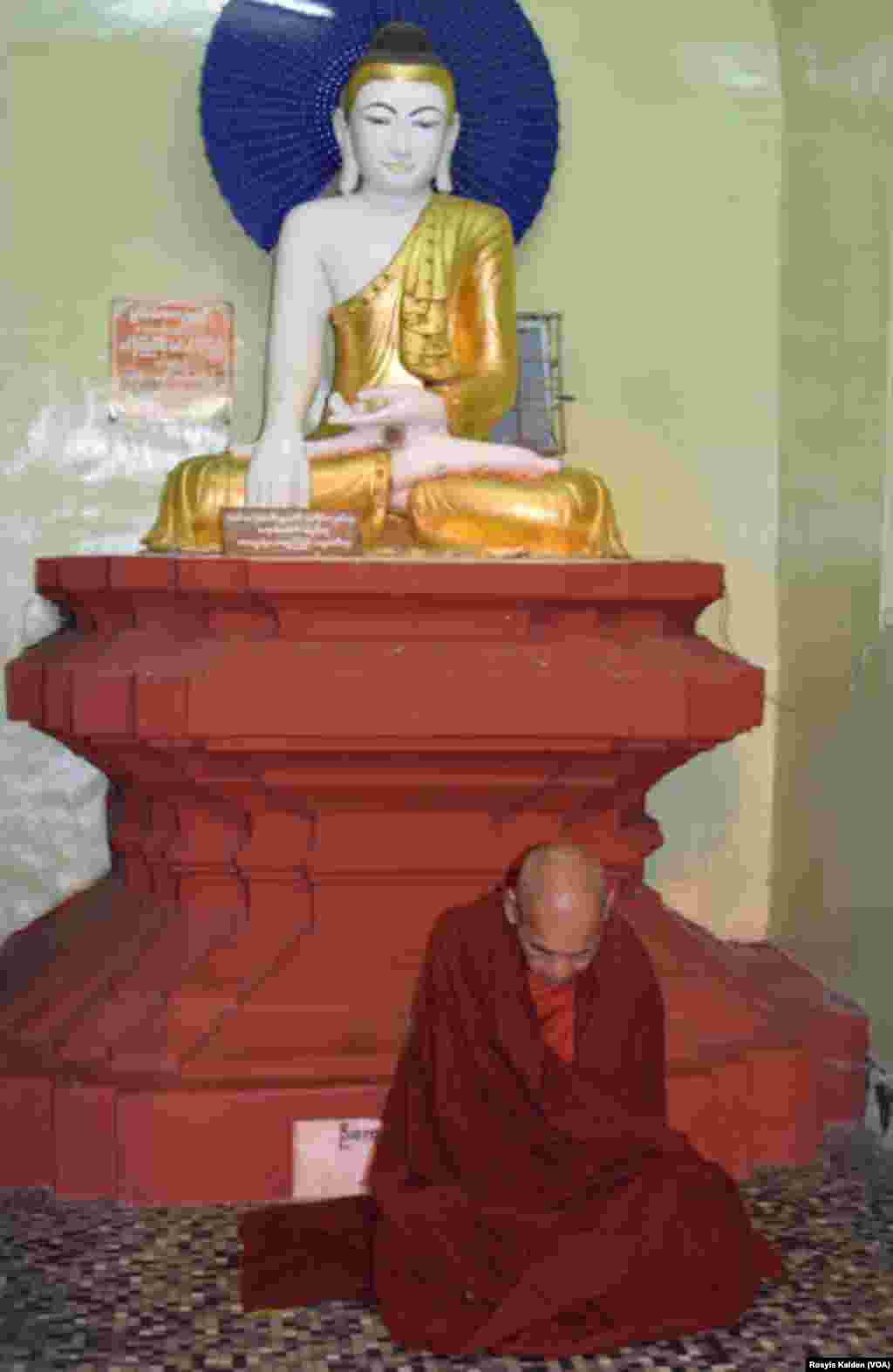 A monk mediates at the Shwedagon Pagoda in Yangon, Myanmar, Nov. 10, 2015.