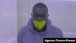 FILE - This video grab from an AFPTV video taken on Jan. 21, 2022 in Kampala shows Kakwenza Rukirabashaija appearing in court via a video link from prison on charges of 'offensive communication.' 