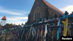 Colorful ribbons can be seen tied to the fence outside St. Patrick's Cathedral, a spontaneous gesture to remember victims of Roman Catholic church abuse, in the town of Ballarat, located west of the southern city of Melbourne in Australia, July 23, 2017. 