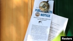 Notices given to homeowners as San Diego County officials hand spray a two block area to help prevent the mosquito-borne transmission of the Zika virus in San Diego, California, U.S. Aug. 19, 2016. 