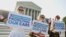 Supporters of the Affordable Healthcare Act gather in front of the Supreme Court before the court's announcement of the legality of the law in Washington, June 28, 2012. 