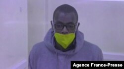 FILE - This video grab from an AFPTV video taken on Jan. 21, 2022 in Kampala shows Kakwenza Rukirabashaija appearing in court via a video link from prison on charges of 'offensive communication.' 