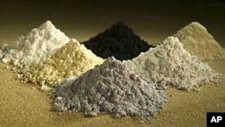 Rare earth oxides from top center clockwise: praseodymium, cerium, lanthanum, neodymium, samarium, and gadoliniun, October 7, 2010.