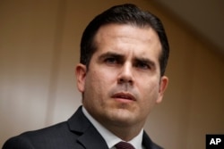 FILE - In this Nov. 13, 2017, photo, Puerto Rico Gov. Ricardo Rossello speaks during a news conference, in Washington. Rosello said on Jan. 22, 2018, that he is privatizing the island’s government-owned power company following decades of mismanagement.