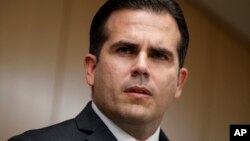 FILE - In this Nov. 13, 2017, photo, Puerto Rico Gov. Ricardo Rossello speaks during a news conference, in Washington. Rossello said on Jan. 22, 2018, that he is privatizing the island’s government-owned power company following decades of mismanagement, corruption and blackouts. 