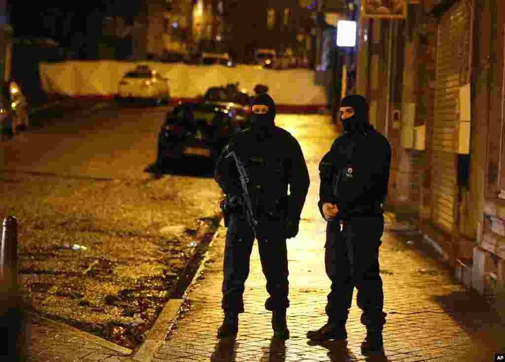 Belgian police officers patrol the streets of Verviers, Belgium, Jan. 15, 2015.