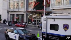 (FILE) Police vehicles are stationed at Union Square following recent robberies in San Francisco, California, Dec. 2, 2021.