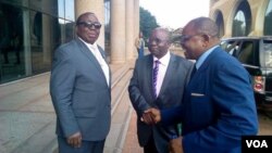 Simon Khaya Moyo and other Zanu PF members outside the party's headquarters in Harare.