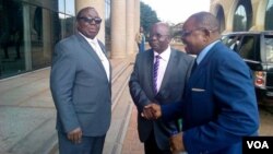 FILE: Simon Khaya Moyo and other Zanu PF members at the party's headquarters in Harare.