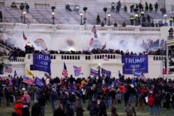 In this Jan. 6, 2021, file photo, rioters storm the Capitol, in Washington. Capitol Police say they have intelligence showing a “possible plot” by a militia group to breach the U.S. Capitol.