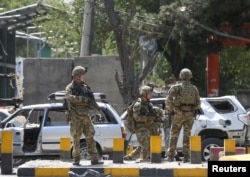 Foreign troops with NATO-led Resolute Support Mission investigate at the site of a suicide attack in Kabul, Afghanistan September 5, 2019. REUTERS/Omar Sobhani