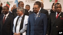 FILE - Sudanese President Omar Hassan al-Bashir, second from right, stands with other leaders during a photo opportunity at an African Union summit in Johannesburg, June 14, 2015.