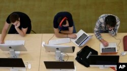 Students work on computers at the Hunt Library at North Carolina State University in Raleigh, N.C., on Tuesday, May 3, 2016. (AP Photo/Gerry Broome)