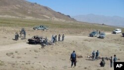 FILE - The scene of an attack is seen in Afghanistan's Paktia province, June 24, 2008.