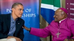 FILE - US President Barack Obama (L) sits next to South Africa's Nobel peace laureate Archbishop Desmond Tutu following a tour of the Desmond Tutu HIV Foundation Youth Centre in Cape Town, South Africa, on June 30, 2013.