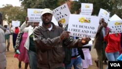 Aliens demonstrating outside the Zimbabwe Electoral Commission offices in Harare where they were demanding to be registered to vote in the forthcoming general election.