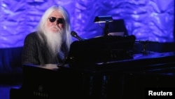 FILE - Inductee Leon Russell performs during the Songwriters Hall of Fame awards in New York, June 16, 2011. 