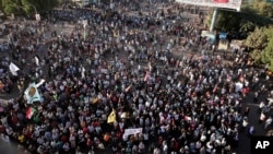 Thousands of protesters take to the streets to renew their demand for a civilian government in the Sudanese capital Khartoum, Nov. 25, 2021. 