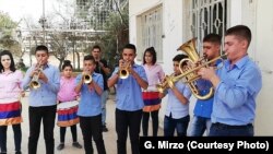 Students practice on instruments donated in Qamishli, Syria, July 2018.