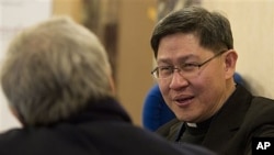 Archbishop of Manila, Philippines, Luis Antonio Tagle, right, at Vatican-backed symposium on clerical sex abuse, Rome, Feb. 9, 2012.