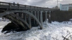 In this Jan. 11, 2020 photo heavy surf surrounds the legs of a bridge as an extreme high tide rolls into the harbor in Depoe Bay, Ore. during a so-called "king tide" that coincided with a big winter storm. (AP)