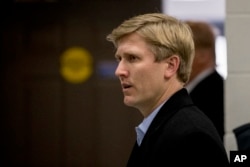 Nick Ayers, center, Vice President Mike Pence's chief of staff, arrives for a news conference with President Donald Trump and Republican congressmen at Camp David, Maryland, Jan. 6, 2018.