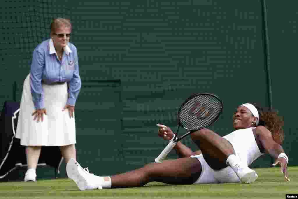 Serena Williams of the U.S. slips during her women&#39;s singles tennis match against Anna Tatishvili of the U.S. at the Wimbledon Tennis Championships, in London.