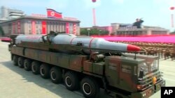 A military truck carrying a missile parades during a ceremony marking the 60th anniversary of the Korean War armistice in Pyongyang, North Korea, July 27, 2013.
