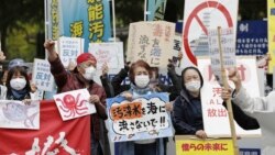People rally to protest against the Japanese government's decision to discharge contaminated radioactive wastewater from Fukushima Daiichi nuclear power plant into the sea, in front of the Fukushima prefectural government headquarters in Fukushima, on Apr