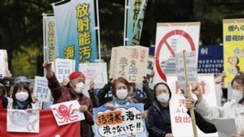 People rally to protest against the Japanese government's decision to discharge contaminated radioactive wastewater from Fukushima Daiichi nuclear power plant into the sea, in front of the Fukushima prefectural government headquarters in Fukushima, on Apr