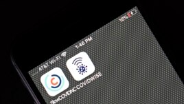 Covid notification apps for North Carolina, SlowCOVIDNC and Virginia, COVIDWISE are shown on a smart phone Friday, Dec. 4, 2020 in Raleigh, N.C. (AP Photo/Gerry Broome)