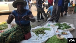On Sept. 16, 2018, a vegetable vendor in Harare says she refuses to leave her business as she has no other sources of income with Zimbabwe’s unemployment rate said to be around 85 percent. (C. Mavhunga/VOA)