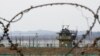 South Korean army soldiers patrol along the barbed-wire fence in Paju, South Korea, near the border with North Korea, on Jan. 5, 2022.