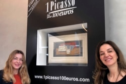 In this photo taken on Tuesday, March 3, 2020, art historian Arabelle Reille, left, and television producer Peri Cochin pose in the Picasso Museum in Paris, in front of "Nature Morte," which Pablo Picasso painted in 1921.