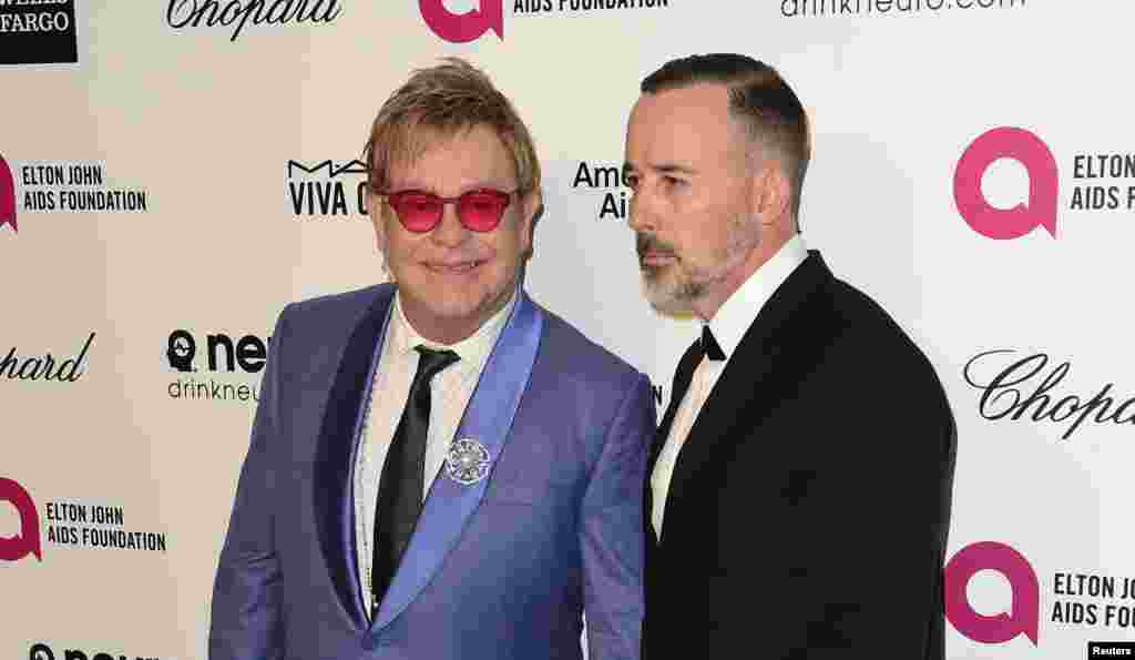 Sir Elton John e o seu marido David Furnish