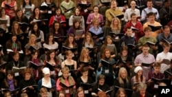 High school students rehearse with professional choristers to prepare for a performance at New York's Carnegie Hall.