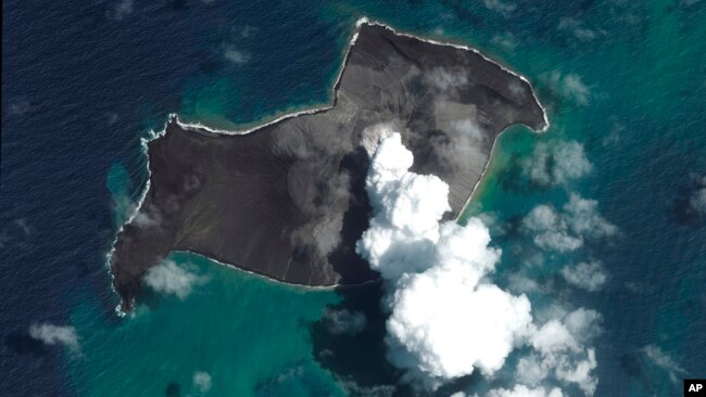 FILE - This satellite image provided by Maxar Technologies shows an overview of Hunga Tonga Hunga Ha'apai volcano in Tonga on Jan. 6, 2022, before a huge undersea volcanic eruption.
